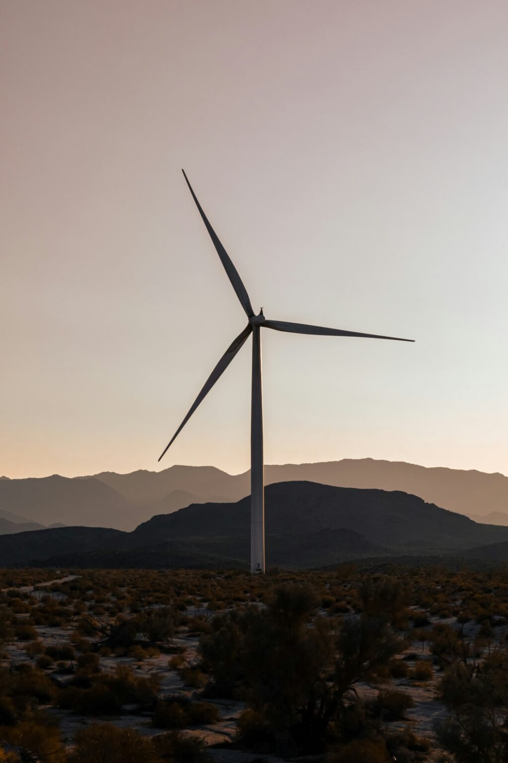 Top 10 Groundbreaking Renewable Energy Projects Transforming the Global Landscape a wind turbine in the middle of a desert